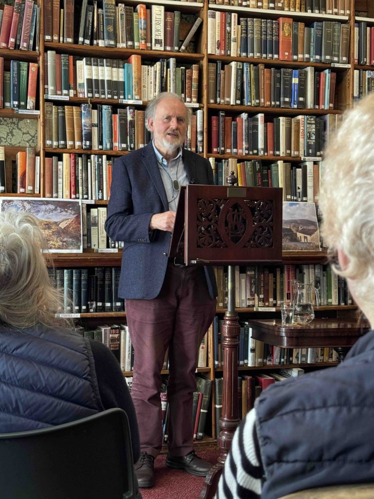 Photo of Dr Tom Greeves giving a literature talk